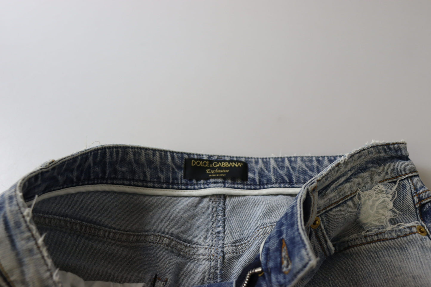 بنطلون جينز أزرق ضيق من القطن المطاطي بخصر منخفض