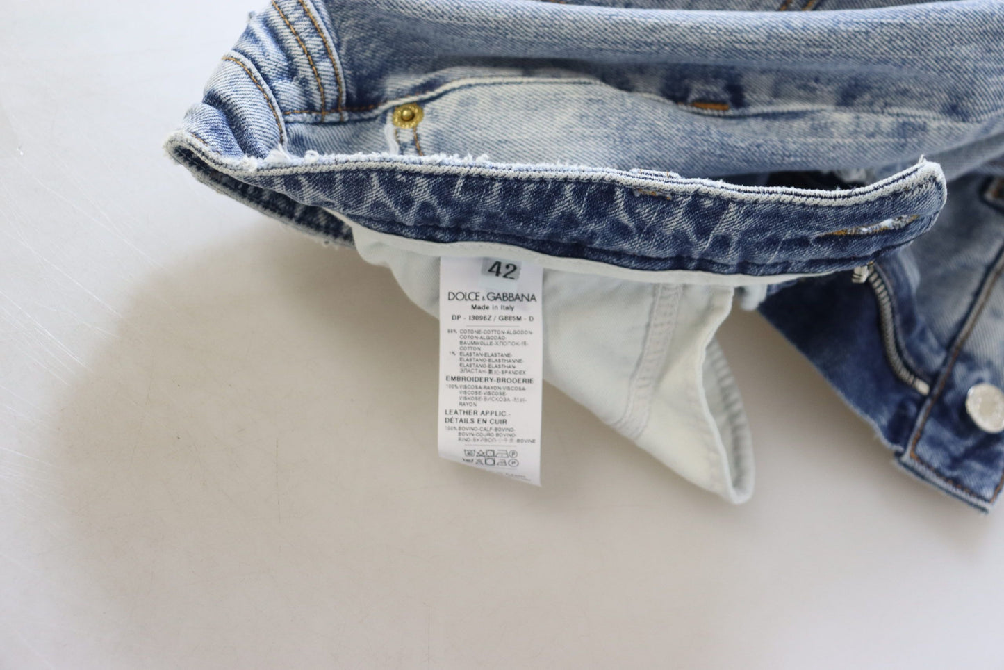 بنطلون جينز أزرق ضيق من القطن المطاطي بخصر منخفض