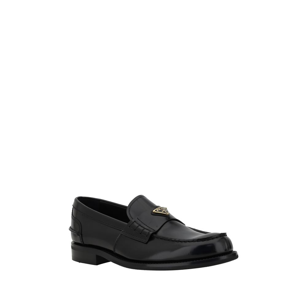 Trekantede loafers med plakette
